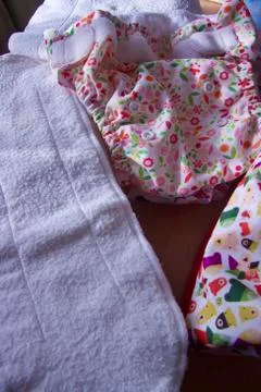 Fabric diapers with removable inserts for eco-care of babies and zero waste Stock Photos