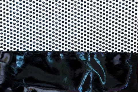 Fabric with dots pattern and lacquered leather as background Stock Photos