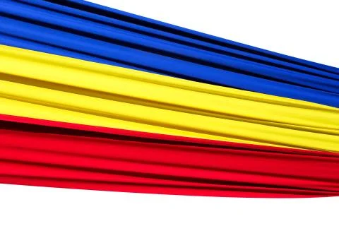 Fabric flag of Romania. Develops in the wind. Isolated on white background. Stock Photos
