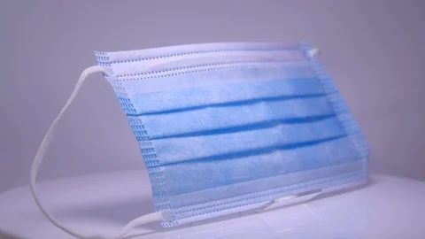 Fabric mask on a white background Stock Footage 129607336