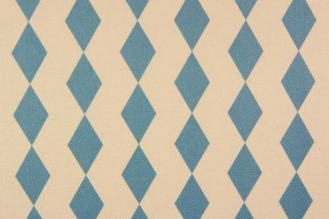 Fabric with a pattern of light blue rhombs on the white background Stock Photos