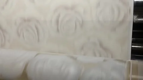 Fabric printing process showing rose patterns in a factory in daylight hours Video stock 332015409