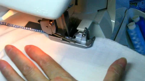 Fabric processing technology at home on an overlock machine Stock Footage 201730348