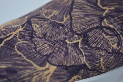 Fabric purple, orange background with a pattern of leaves. Foto stock
