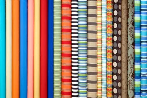 Fabric in rolls, different design Stock Photos