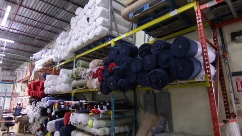 Fabric Rolls On Shelf Stock Footage 122454533
