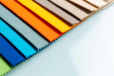 Fabric samples set on a table. Stock Photos