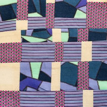 Fabric sewn in convergence patchwork technique Stock Photos