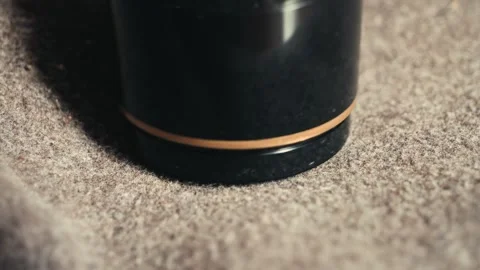 A fabric shaver remove pilling from a coat close up. Stock Footage 330589351