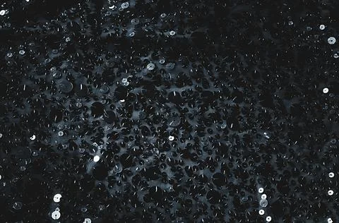 Fabric Silver texture with spangles. Background sequin. Glitter texture. Fabr Stock Photos