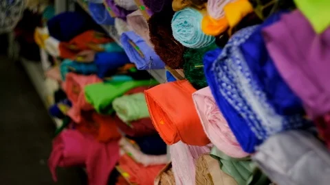 In the fabric store a large selection of fabrics, you can cut a piece and buy, Stock Footage 123404400