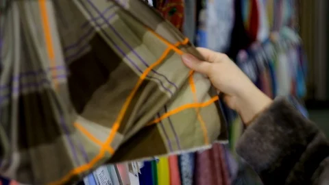 In the fabric store a large selection of fabrics, you can cut a piece and buy, Stock Footage 123416496