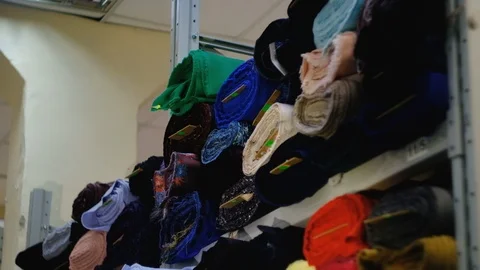 In the fabric store a large selection of fabrics, you can cut a piece and buy, Stock Footage 123446417