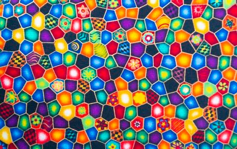Fabric textile with bright patterns multi-colored background Stock Photos