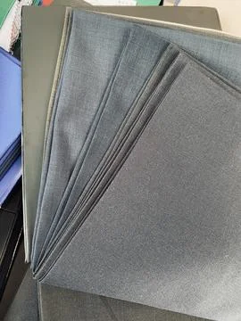 Fabric textile sample for men suits jacket on the table Foto stock