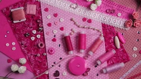 Fabric, thread and sewing supplies pink color Stock Footage 73360639