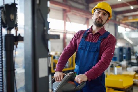 Fabric worker using a machine Stock Photos