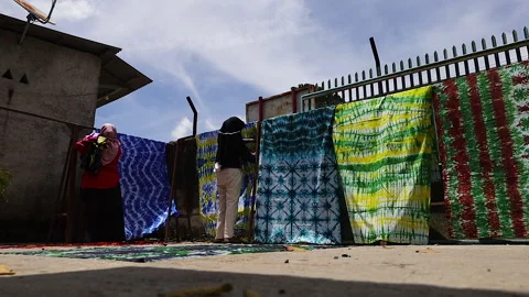 Fabrics dyed with batik techniques Stock Footage 304846517