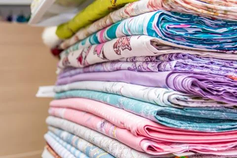 Fabrics in the shop window for needlework. Stock Photos