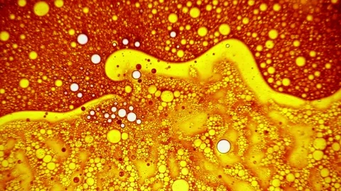Fabulous golden liquid art pattern appearing on the surface of dye Stock Footage 124425416