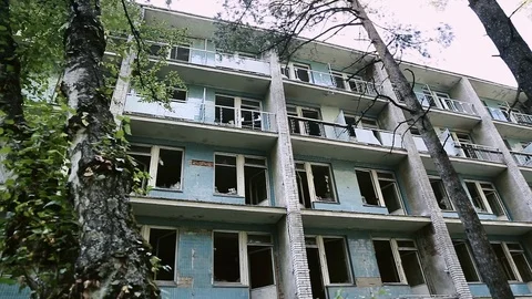 Facade of an abandoned building. Almost collapsed and ruined city block Vídeos de archivo 110436509