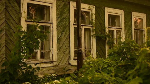 Facade of an abandoned house in the sunlight Stock Footage 148256225