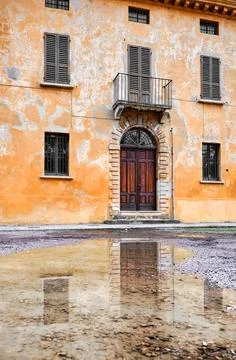 The facade of an ancient house Stock Photos