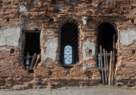 Facade and arched windows of an old abandoned building Stock Photos