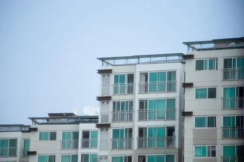 The facade of an apartment of the same shape and pattern. Stock Photos