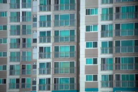 The facade of an apartment of the same shape and pattern. Stock Photos