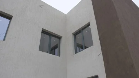 Facade in beige and brown tones reflects calm architecture Stock Footage 313832236