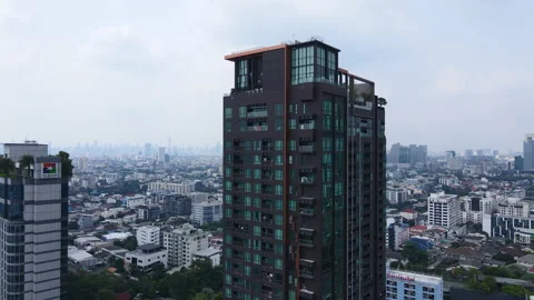 Facade of black building with blue window pane. Residential apartments in Stock Footage 210799686