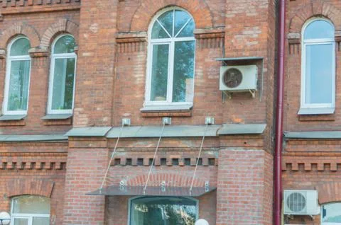 Facade of a brick building with Windows Fotos Stock