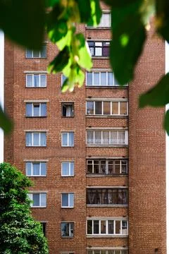 Facade of a brick building with windows Stock Photos