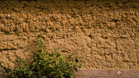 Facade of a brown clay wall Видео 94642110