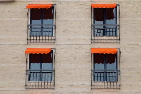 Facade Of Building With Orange Awning Stock Photos