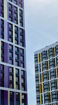 The facade of the building in purple,geometric patterns from windows and Stock Photos