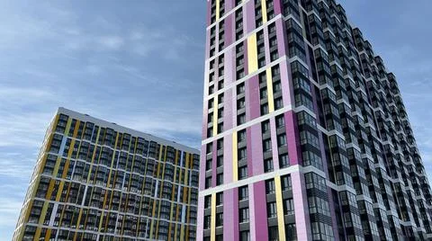 The facade of the building in purple,geometric patterns from windows and Stock Photos