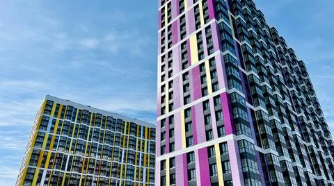 The facade of the building in purple,geometric patterns from windows and 스톡 사진