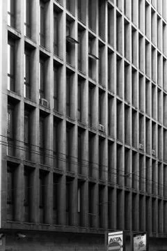 Facade of a building with rectangular window pattern Stock Photos