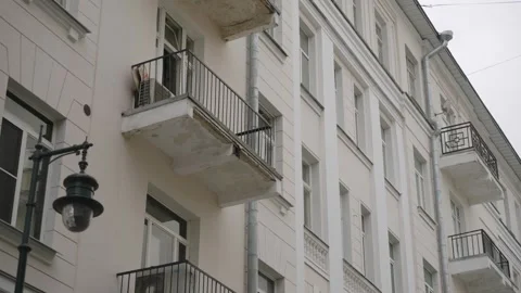 The facade of the building is in the Soviet style with balconies. Bottom view. Stock Footage 320898661