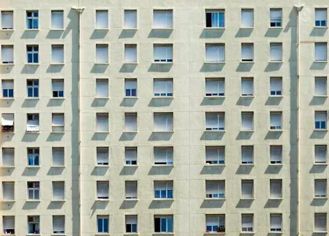 Facade of a building with windows and shadows shot in France Stock-Fotos