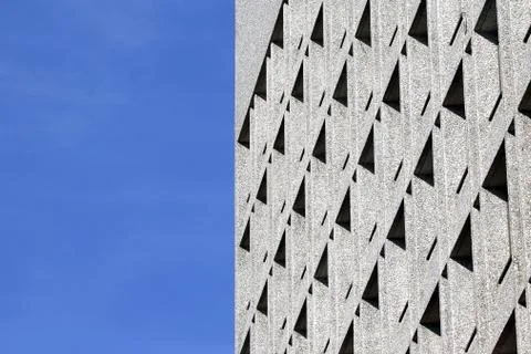 The facade of the building with Windows on the background of blue sky Stock Photos