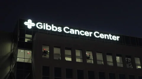Facade of Cancer Centre Building in Evening Night Time. Cancer Centre Build.. Video stock 333696629