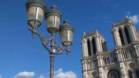 Facade Cathedral Notre dame de Paris in a sunny day. Panning 4K 库存影片 237760565