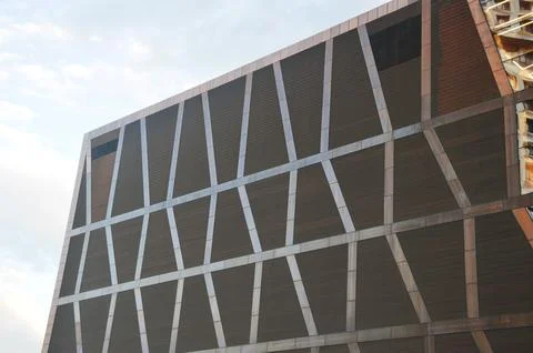 Facade cladding of the building. Decorative brown geometric panels arranged i Stock Photos