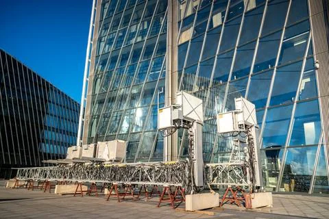 Facade cleaning device for skyscraper glass walls. Automated window washing.. Stock Photos