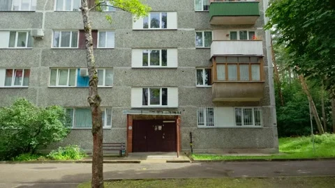 Facade of concrete panel apartment building with entrance in residential Stock Footage 342683626