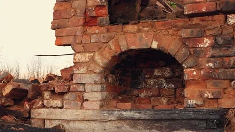 The facade of the destroyed red brick oven, the remains of a burnt house. Stock Footage 224679588