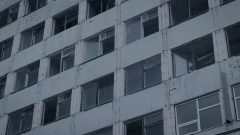 Facade of a dilapidated apartment building with broken windows. Stock Footage 150364494